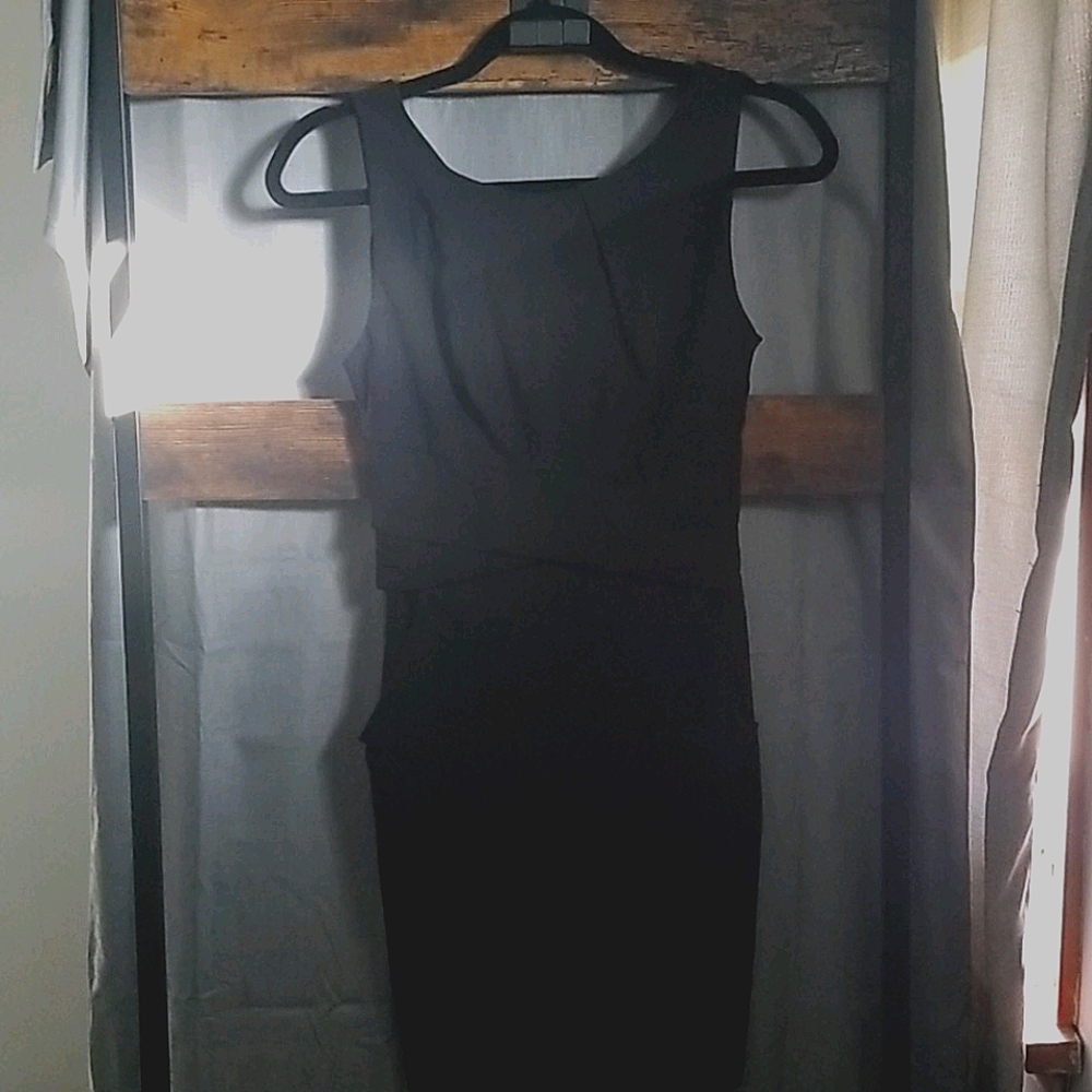 EUC.  Form fitting little black dress with pockets